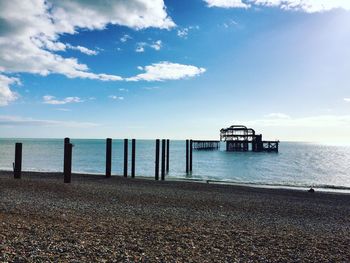 West pier amidst sea against sky