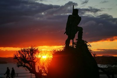 Silhouette of people at sunset