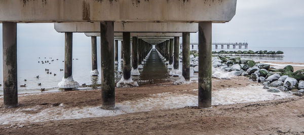 View of pier over sea against sky