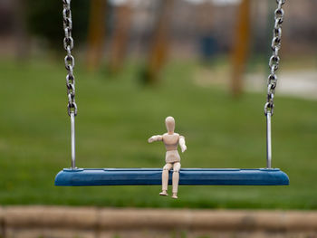 Close-up of swing in park