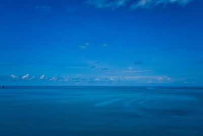 Scenic view of sea against blue sky