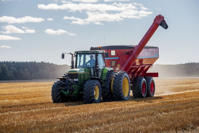 Combine harvester on field, sweden