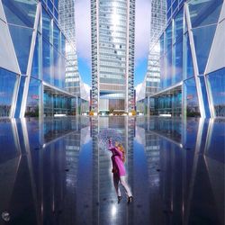 Woman standing in front of modern building