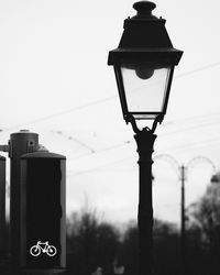 Low angle view of street light against sky