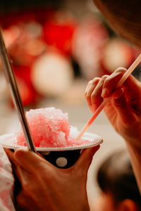 Close-up of hand holding ice cream