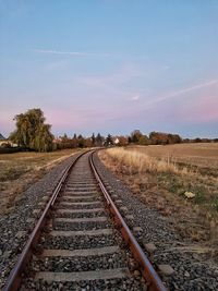 View of railroad track along trees