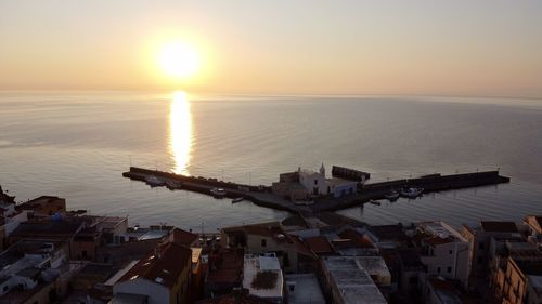 High angle view of sea against sky during sunset