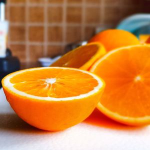 Close-up of orange juice on table