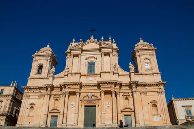 Low angle view of cathedral against clear blue sky