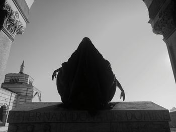 Low angle view of statue against sky