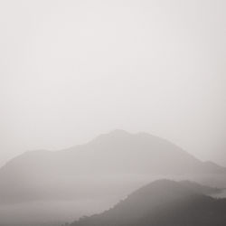 Scenic view of mountains in foggy weather