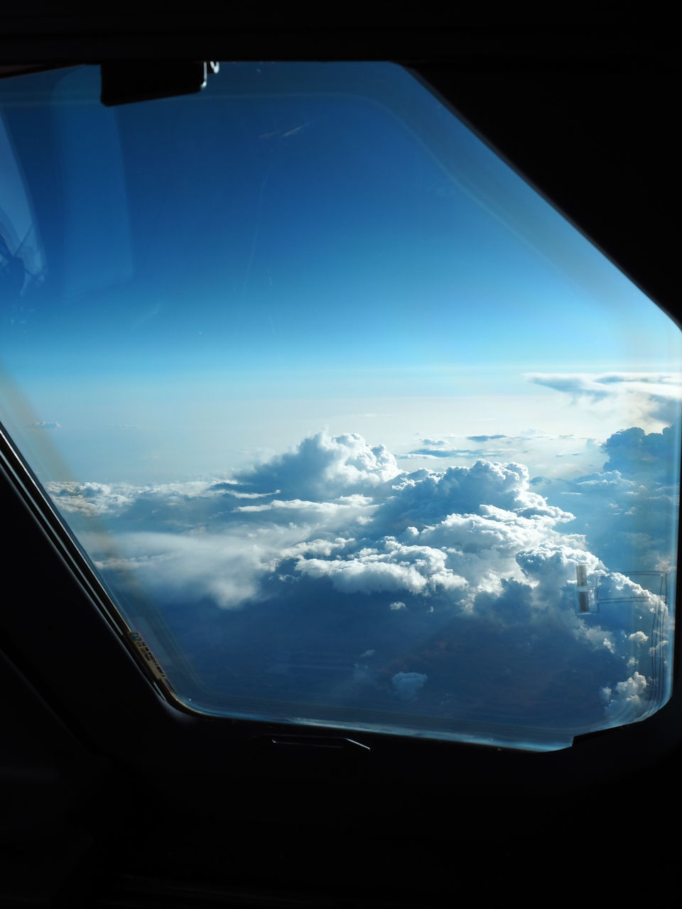 AERIAL VIEW OF SKY SEEN THROUGH AIRPLANE WINDOW