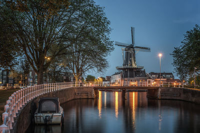 View of traditional windmill "de adriaan  at riverbank