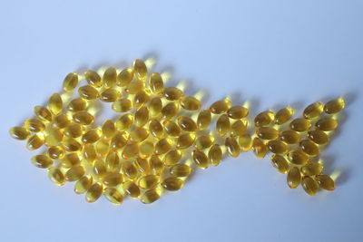 Close-up of fresh yellow spring against sky over white background