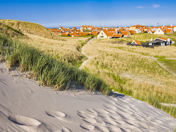 Town on coast among sand dunes