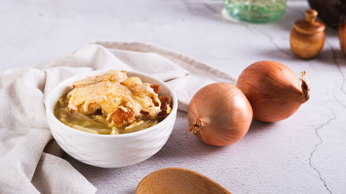 Homemade onion soup with croutons and cheese in a bowl on the table web banner