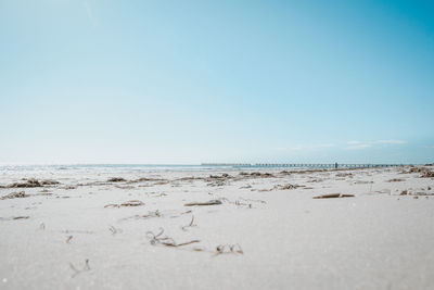 Scenic view of beach against clear sky