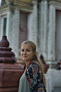 Portrait of woman standing outdoors