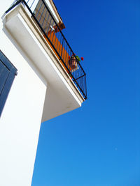 Low angle view of building against clear blue sky