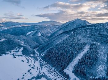 Scenic view of snowcapped mountains against sky