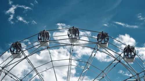 Low angle view of cables against blue sky