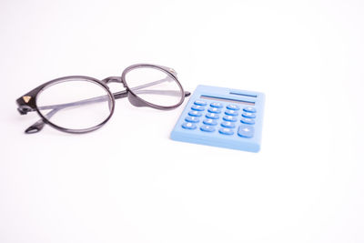 High angle view of eyeglasses on white background