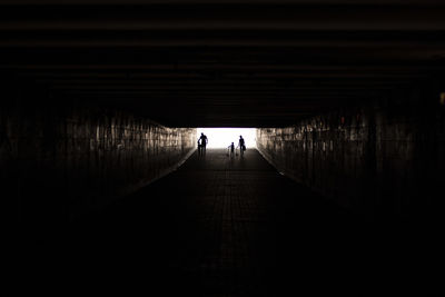 People walking in subway tunnel