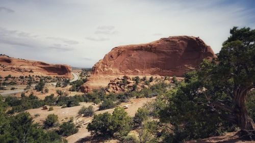 Rock formations on landscape against sky