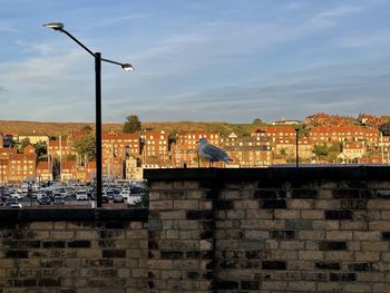 View of brick roof againts blue skies. 