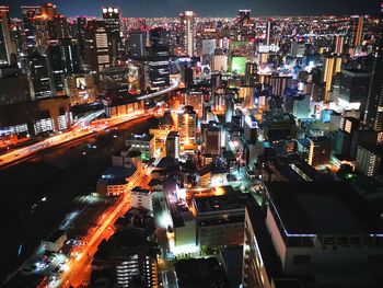 High angle view of illuminated buildings in city at night