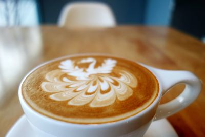 Close-up of cappuccino served on table