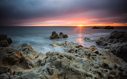 Scenic view of sea against sky during sunset