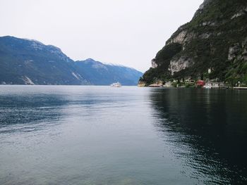 Scenic view of mountains and river against sky