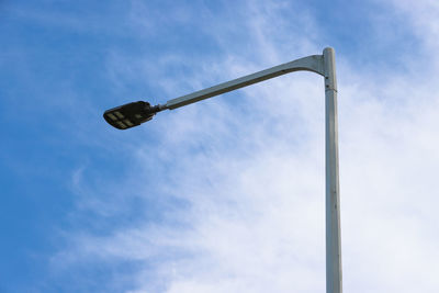 Low angle view of street light against sky