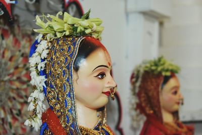 Close-up of woman with arms raised