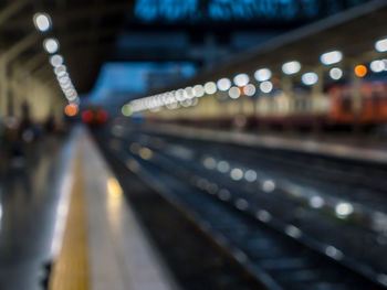 Defocused image of illuminated railroad station at night