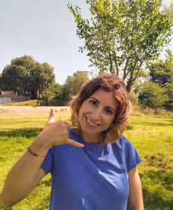 Young girl with gesture of calling on the phone with her hand