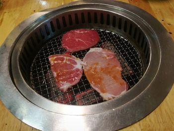 High angle view of meat in container on table