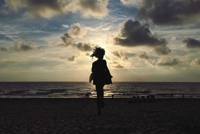 Scenic view of sea against cloudy sky