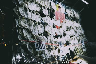 Clothes hanging on display at market stall
