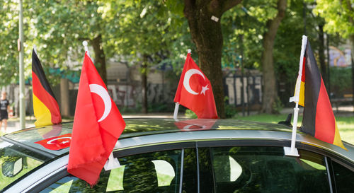 Turkish and german flags on car