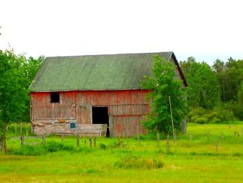Old house on grassy field