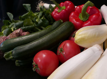 Close-up of red tomatoes and bell peppers