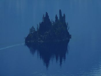 Scenic view of sea against blue sky