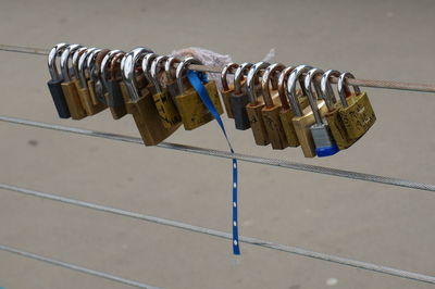 Close-up of padlocks on railing