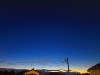 Low angle view of vapor trails in sky