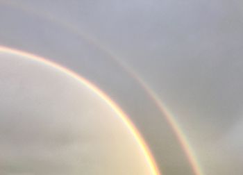 Low angle view of rainbow against sky