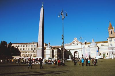 Group of people in front of historical building