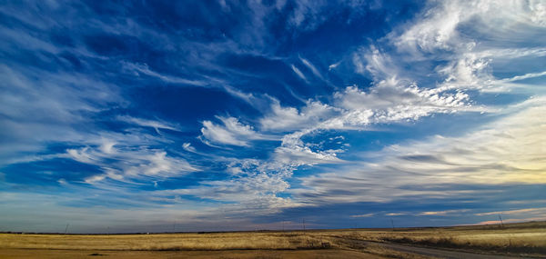 Aerial view of landscape against blue sky