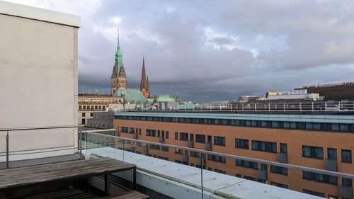 Buildings in city against sky